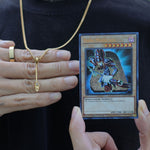dark magician staff from yugioh next to a yugioh dark magician card